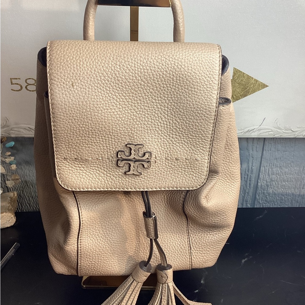 Tory Burch Pebbled Leather Tassel Backpack in Light Beige